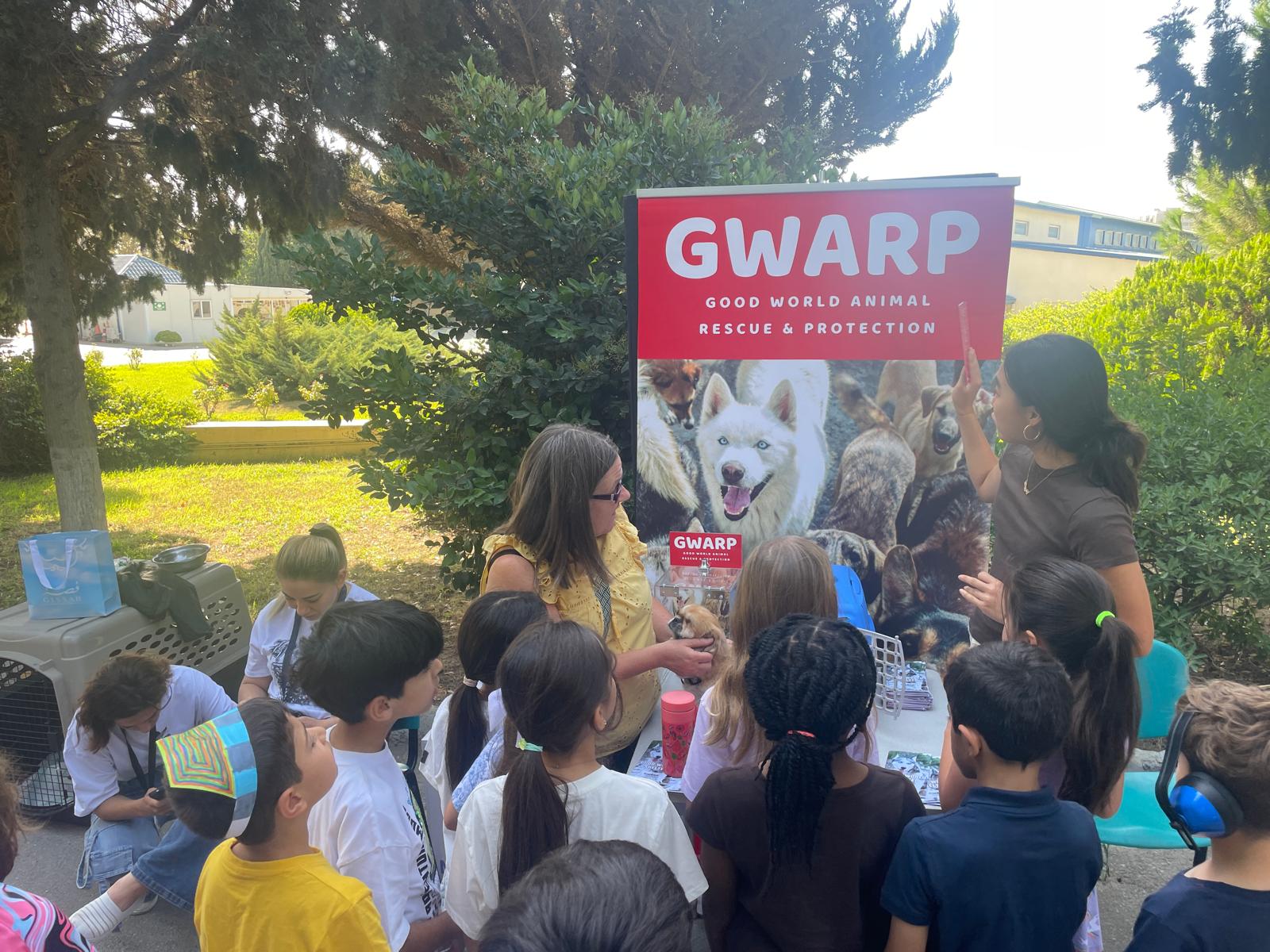 Children learn about dogs at a community outreach event